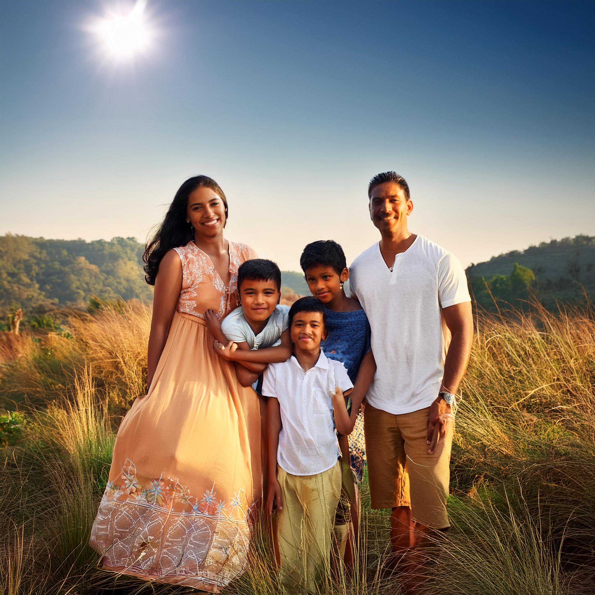 family 5 5 standing in a meadow