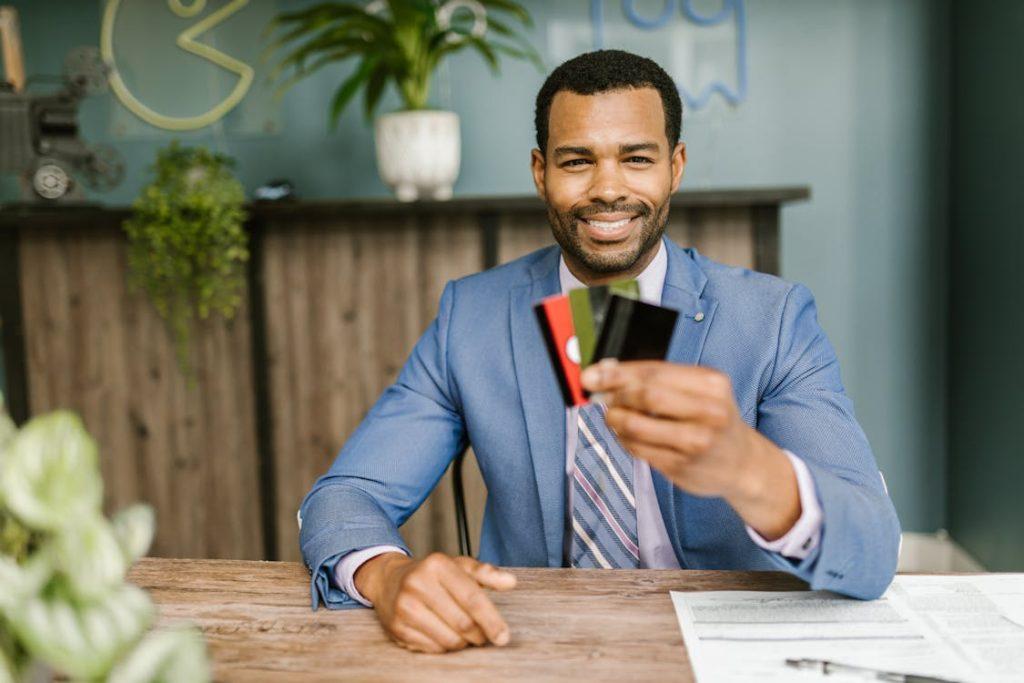 a person holding credit cards